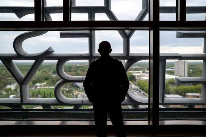 Obama standing in the Sky Room at his presidential Center.