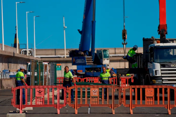 Workers prepare the area where passengers from the MV Hondius cruise ship are expected to arrive