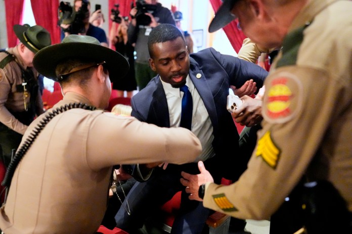 KeShaun Pearson is arrested and removed from the House gallery by state troopers during a special session of the state legislature to redraw U.S. Congressional voting maps Thursday, May 7, 2026, in Nashville, Tenn.