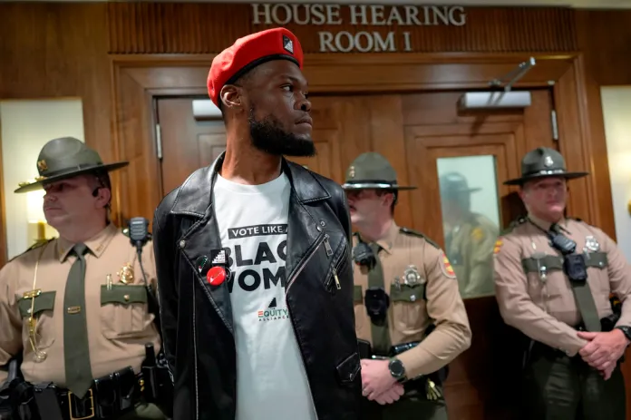 Deonte Williams stands outside a House committee hearing room after it was cleared by state trooper during a special session of the state legislature to redraw U.S. Congressional voting maps Wednesday, May 6, 2026, in Nashville, Tenn.