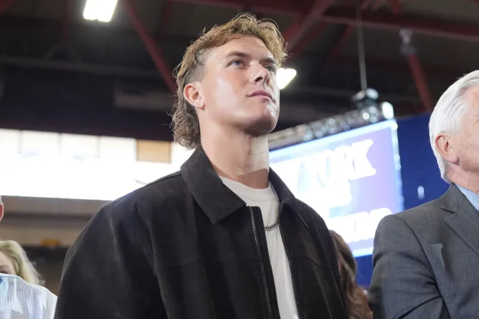 New York Giants quarterback Jaxson Dar listens as President Donald Trump speaks at Rockland Community College, Friday, May 22, 2026, in Suffern, N.Y. (AP Photo/Alex Brandon)
