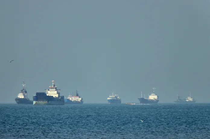 Ships wait in the Strait of Hormuz
