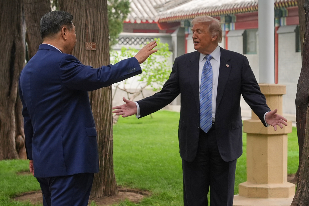 President Donald Trump talks with China's President Xi Jinping at the Zhongnanhai leadership compound, Friday, May 15, 2026, in Beijing. (AP Photo/Mark Schiefelbein, Pool)