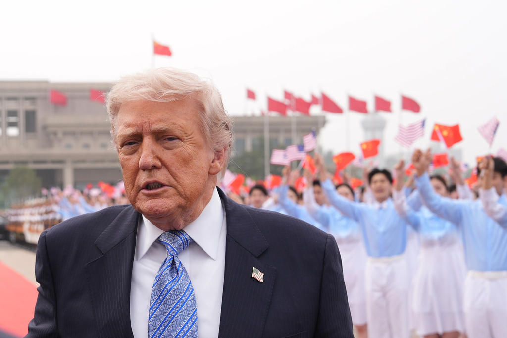 President Donald Trump walks to board Air Force One, Friday, May 15, 2026, at Beijing Capital International Airport in Beijing. (AP Photo/Mark Schiefelbein)