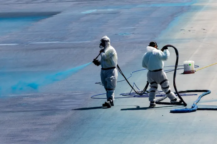 Crews spray a new blue coating on the Lincoln Memorial Reflecting Pool.