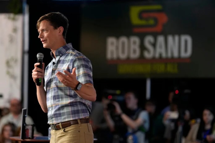 Iowa Democratic gubernatorial candidate Rob Sand speaks during a campaign rally, Sunday, June 7, 2026, in Des Moines, Iowa. (AP Photo/Charlie Neibergall)