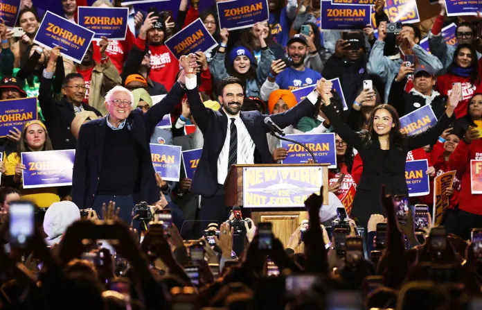 Sen. Bernie Sanders (I-VT), then-mayoral candidate Zohran Mamdani and Rep. Alexandria Ocasio-Cortez (D-NY) appear on stage during a rally on Oct. 26, 2025. (Heather Khalifa/AP)