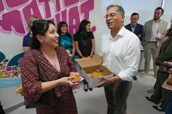 California Democratic gubernatorial candidate Xavier Becerra thanks Amy Perez for her support as he passes out cookies at the Planned Parenthood headquarters in Sacramento, Calif., Monday, June 1, 2026. 