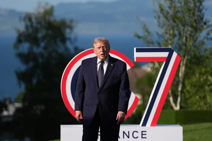 Trump in front of G7 sign