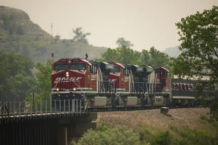 The Freedom 250 train, with President Donald Trump aboard, arrives at the grand opening of the Theodore Roosevelt Presidential Library