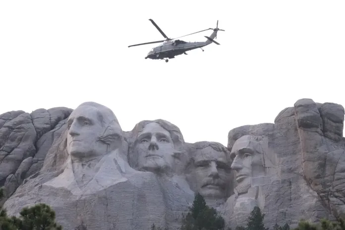 Marine One, with President Donald Trump aboard, passes Mount Rushmore National Memorial, Friday, July 3, 2026, near Keystone, S.D. 