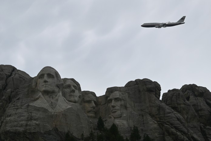 Air Force One performs a flyover at Mount Rushmore National Memorial, Friday, July 3, 2026, in Keystone, S.D. (AP Photo/Matt Gade)