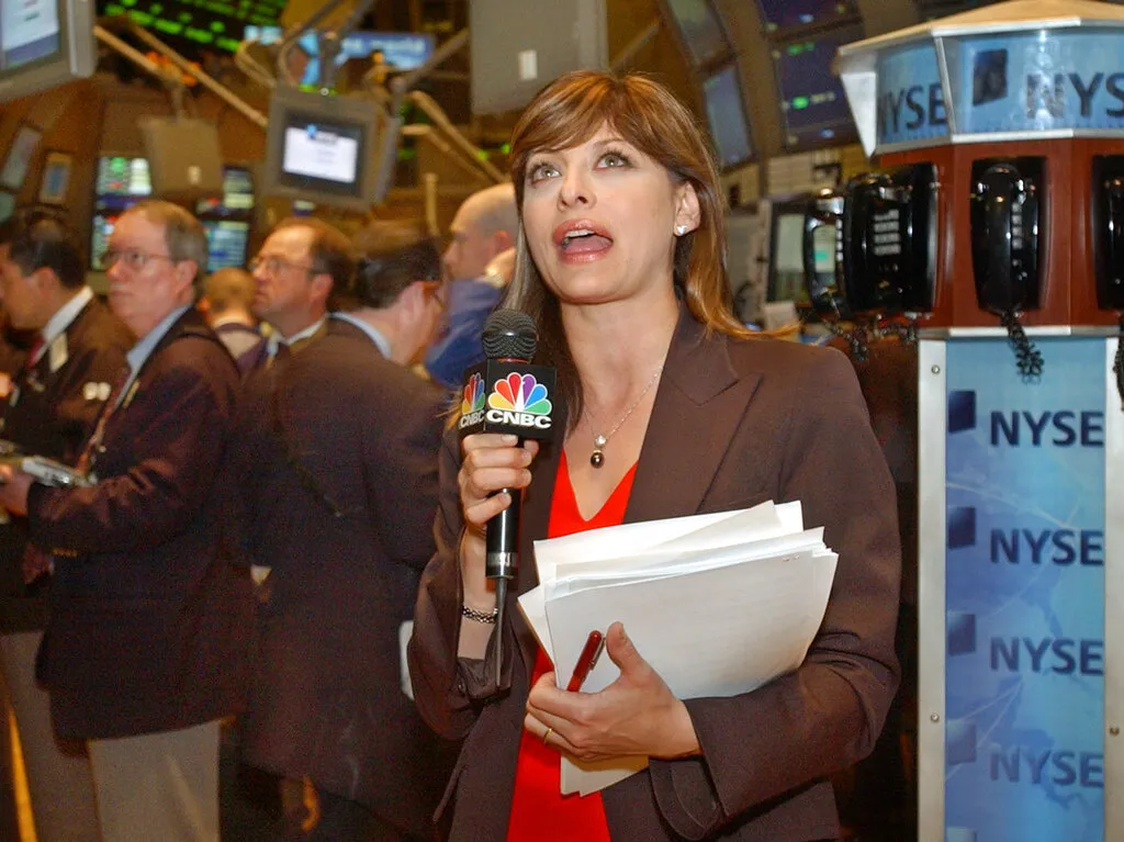 CNBC reporter Maria Bartiromo delivers her last report from the floor of the New York Stock Exchange, shortly after the opening bell, Friday May 14, 2004. Nicknamed the Money Honey by New York tabloids, Bartiromo was the first TV reporter permitted on the exchange's floor, where she'd deliver rapid-fire specifics on the market's rise and fall. She is leaving CNBC's morning show, "Squawk Box," to concentrate on other duties at CNBC and NBC.